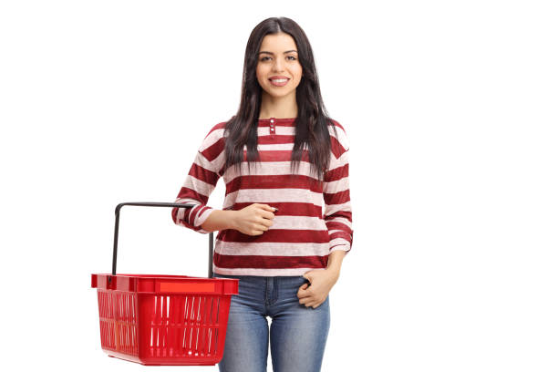istock Young woman holding an empty shopping basket 853908706