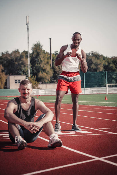 istock A happy black athlete with a card against the defeated 853908716