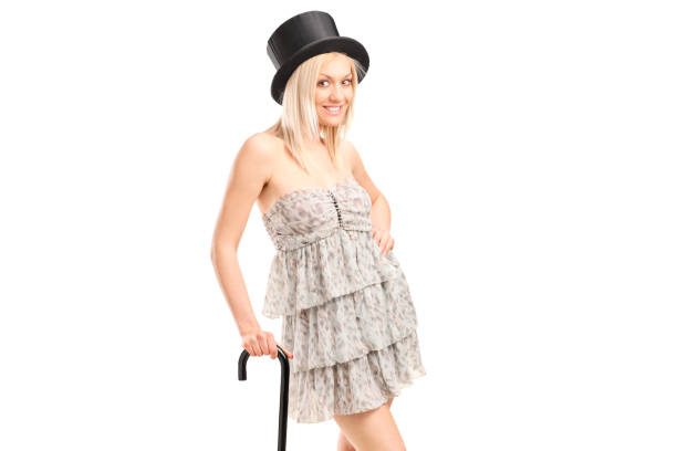 istock Young woman with a cane and a top hat 853908850