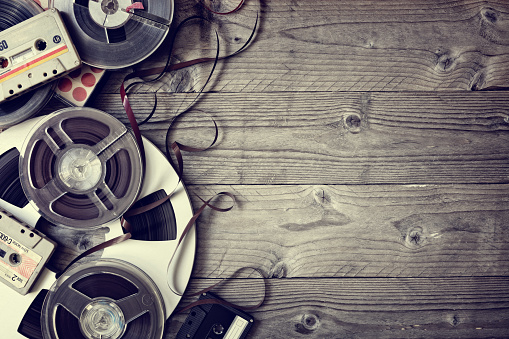 Retro audio reels and cassette tape with copyspace