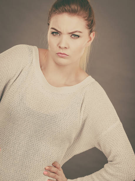 istock Confused young blonde woman looking suspicious 853912762