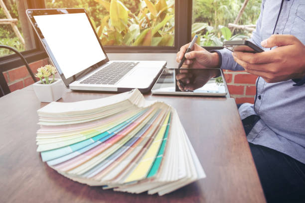 istock Creative creativity graphic designer working with graphics tablet,laptop and smart phone, colour chart at workplace on wooden desk , colour ideas style concept 853916674