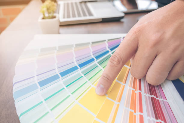 istock Creative creativity graphic designer working with graphics tablet,laptop and smart phone, colour chart at workplace on wooden desk , colour ideas style concept 853916682