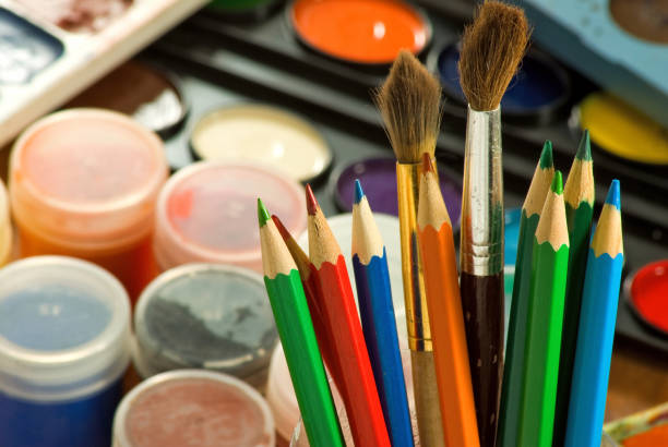 istock image of paints and colored pencils close-up 853920150