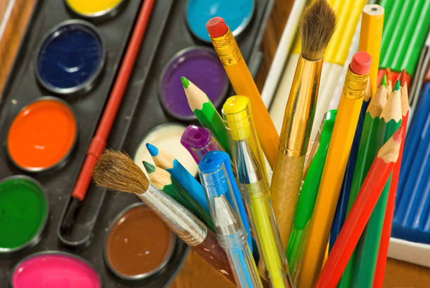 istock image of paints and colored pencils close-up 853920156