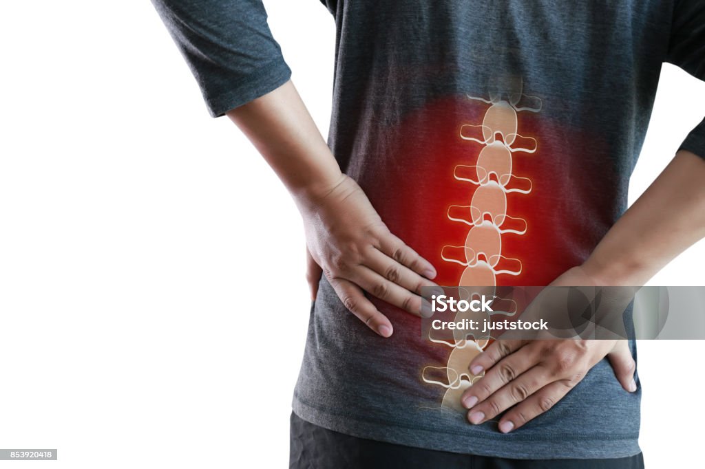 young man Feeling suffering  Lower back pain  Pain relief concept Adult Stock Photo