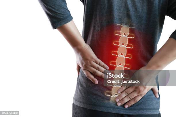 Young Man Feeling Suffering Lower Back Pain Pain Relief Concept Stock Photo - Download Image Now