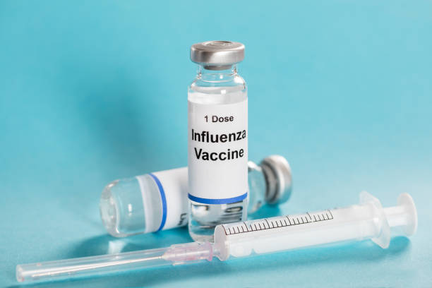 istock Influenza Flu Vaccine Vials With Syringe 853922870