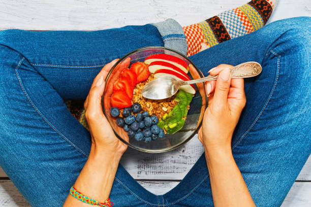 istock Young woman having healthy breakfast 853924354