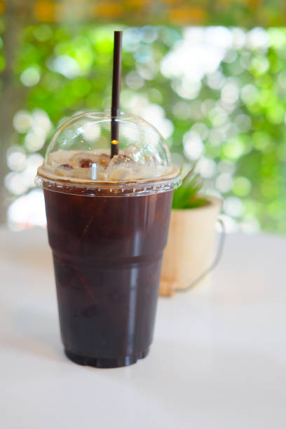 istock Takeaway plastic cup of iced black coffee americano 853927210