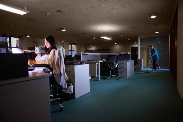 istock young businesswoman working late 853927572