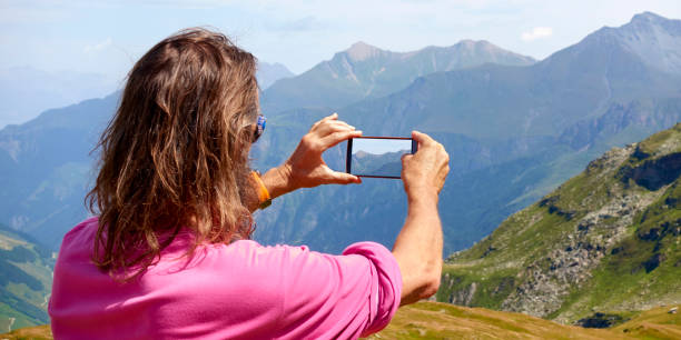 istock Swiss Mountain Photo with Cell Phone 853927584
