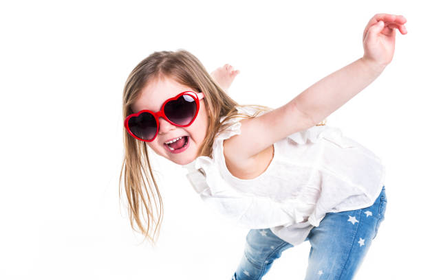istock Little girl with love glasses on studio white background 853927780