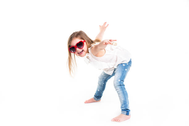 istock Little girl with love glasses on studio white background 853927838