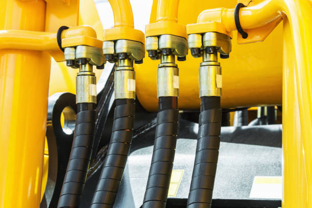 idraulica trattore giallo - hydraulic platform hose oil industry industry foto e immagini stock