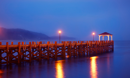 first light view of the deserted village dock at Northport, Long Island, NY blue hour just before dawn