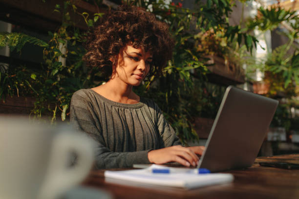 istock Young woman working on laptop 853930980