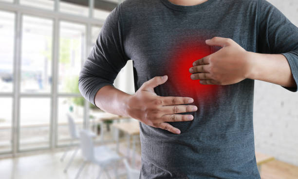 istock MAN with symptomatic acid reflux , suffering from acid reflux 853931036