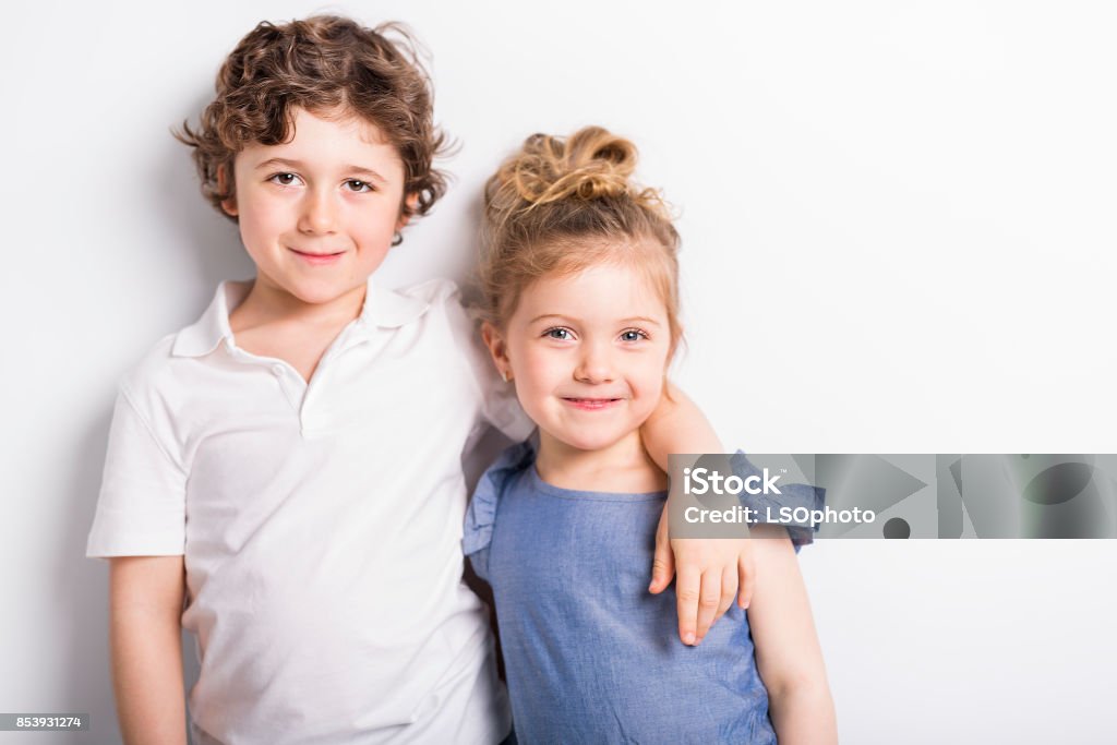 Happy Brother and Sister Hugging each other Girls Stock Photo