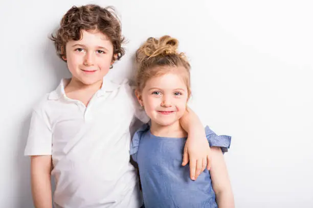 Photo of Happy Brother and Sister Hugging each other