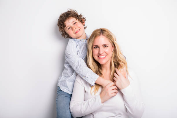 A Portrait of mother and son in studio white background