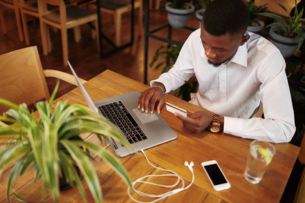 istock African man pay with and buying in internet shop 853934756