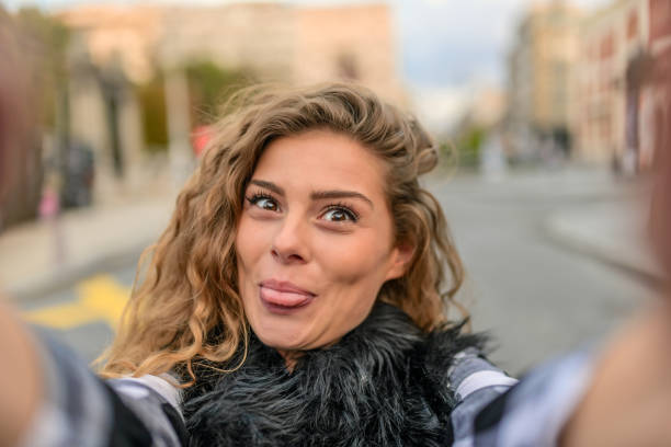 istock Smiling woman taking a selfie photo 853935352