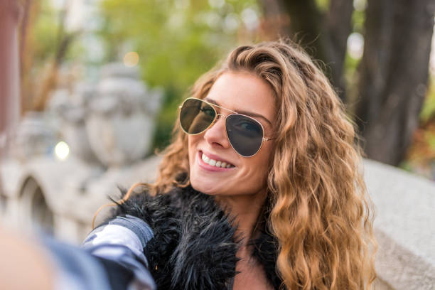 istock Smiling woman taking a selfie photo 853935358