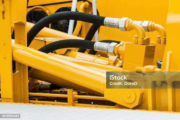 Pipes And The Hydraulic System Of The Tractor Stock Photo - Download Image Now - Cylinder, Hydraulic Platform, Hydraulics