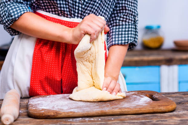 istock housewife kneading dough 853938994
