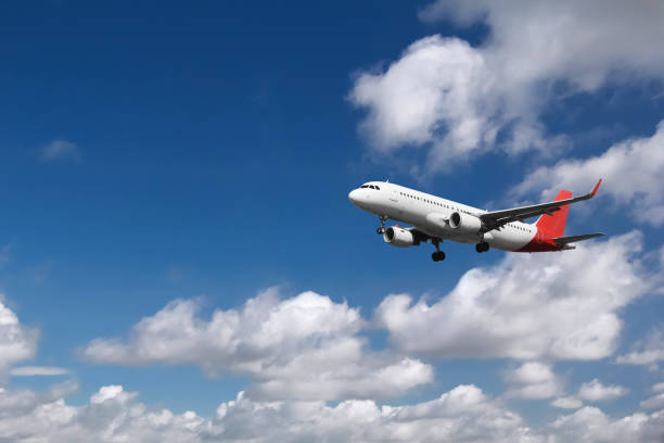 istock Passenger airplane landing with clouds in the background 853939036