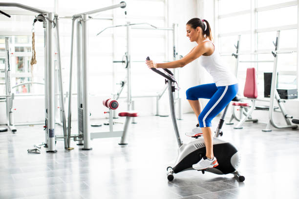istock Aerobics exercising woman exercise workout at bikes gym 853939096