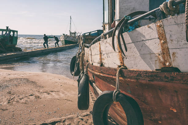 Old motorized fishing vessels are preparing to leave for the Baltic Sea for summer fishing