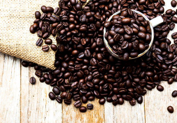 coffee beans cup on wood background