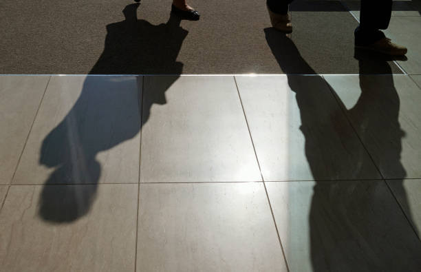 istock shadows of people 853948668