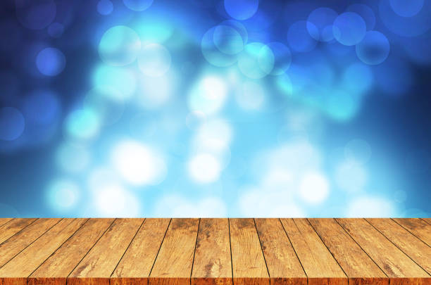istock Wood table top on yellow bokeh abstract background - can be used for montage or display your products 853951702
