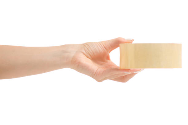 istock A female hand holding an adhesive tape 853960250