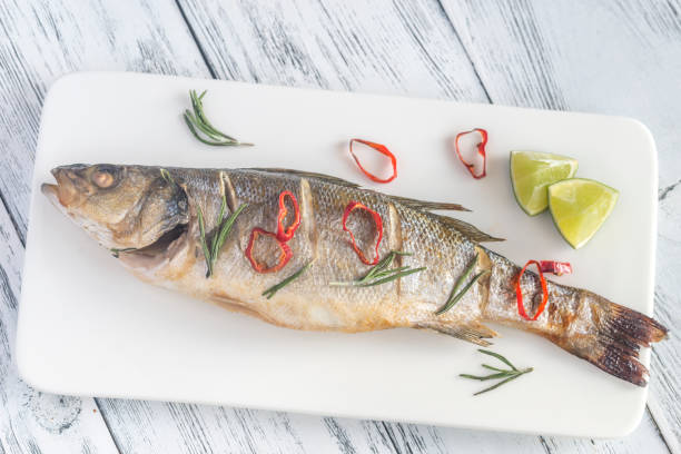 istock Baked sea bass with lime and chilli pepper 853965250