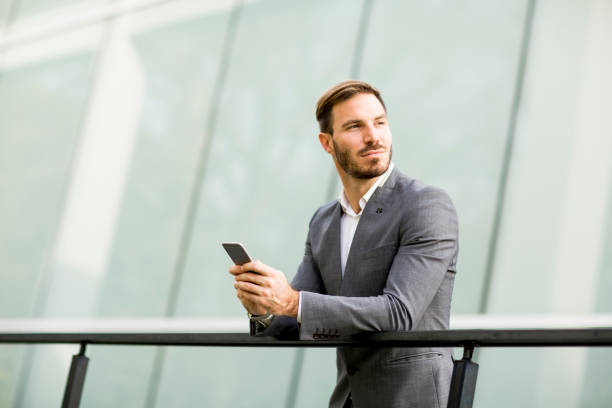 istock Young businessman calling on mobile phone at outdoor 853965630