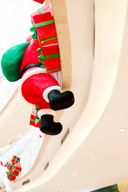 istock Santa claus pupper is climbing up a house 853966288