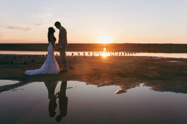 istock Beautiful bride and groom couple walking at the wedding 853968802