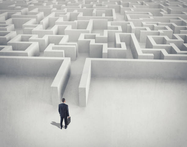 istock Business challenge. A businessman navigating through a maze. Top view 853969296