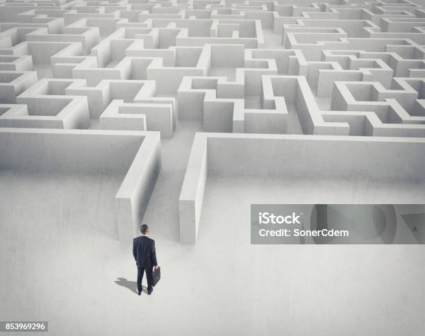 Business Challenge A Businessman Navigating Through A Maze Top View Stock Photo - Download Image Now