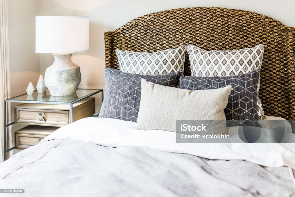 https://media.istockphoto.com/id/853970390/photo/closeup-of-new-bed-comforter-with-decorative-pillows-headboard-in-bedroom-in-staging-model.jpg?s=1024x1024&w=is&k=20&c=wRqxL1da3AMX9x7DQ0LGkb2_VO_vLKQig1w98lkmcwo=