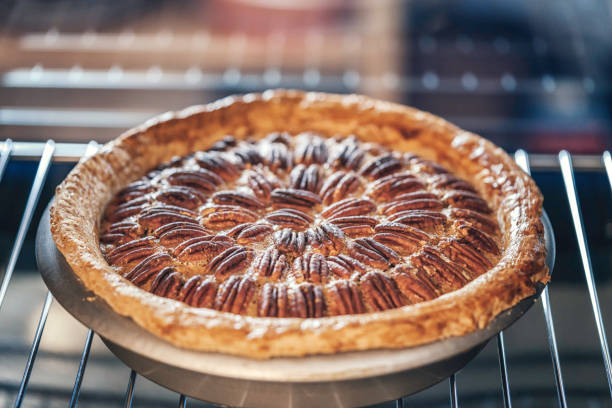 istock Baking Pecan Pie in The Oven for Holidays 853981388