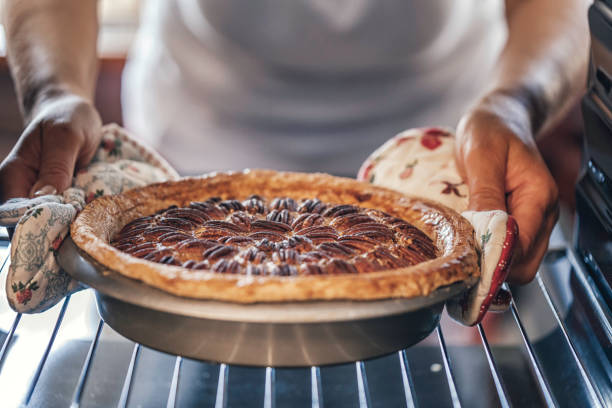 istock Baking Pecan Pie in The Oven for Holidays 853981406