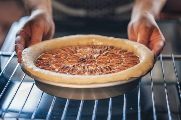 istock Baking Pecan Pie in The Oven for Holidays 853981412