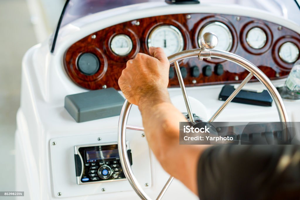 rudder boat, boat management and vessel navigation navigation and control on a yacht, steering wheel and instruments Helm - Nautical Vessel Part Stock Photo