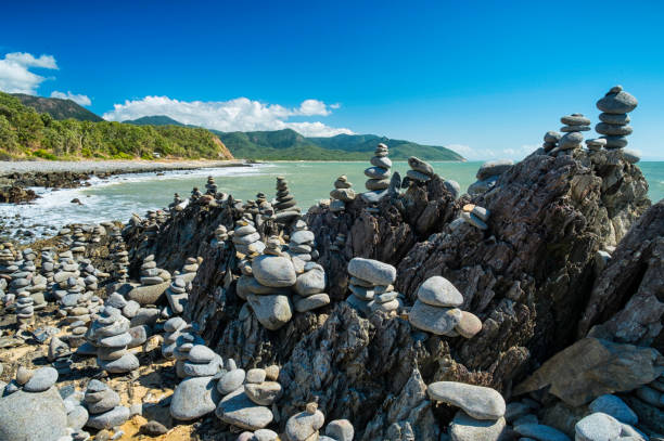 Balancing Rocks Of North Queensland North of Cairns in Queensland there is a beach where people balance stones. Don't know why, they just do. cairns australia stock pictures, royalty-free photos & images