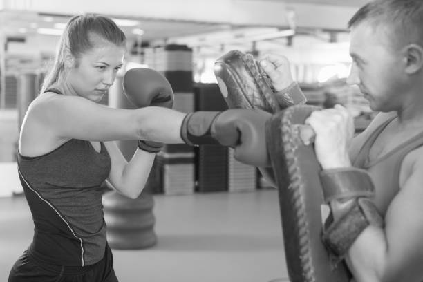 istock Woman training punch in gym 854000986